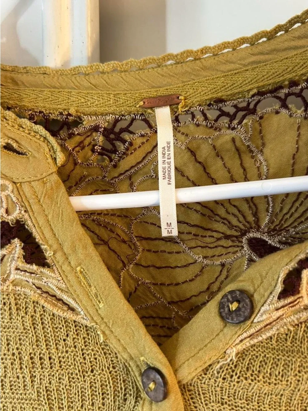 Free People embroidered henley long sleeve thermal top in an earthy green tone
